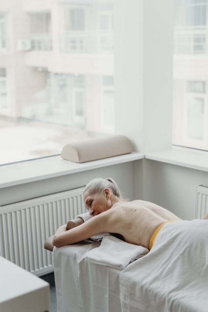 Man Lying on Bed Near Window